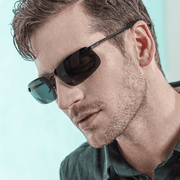 Man looking down wearing a grey Polarized Chromatic Sunglasses