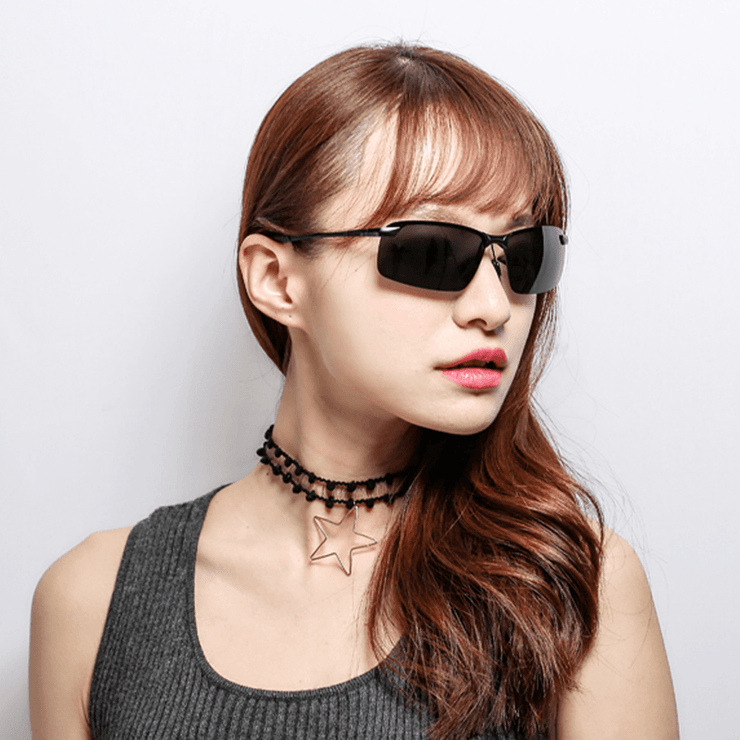 Woman looking to the side wearing a black Polarized Chromatic Sunglasses